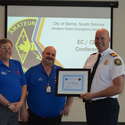 Brant (VE3UME) and Jason (VE3JXT) presenting a certificate of recognition to Deputy Fire Chief Jeff Weber for all of his support